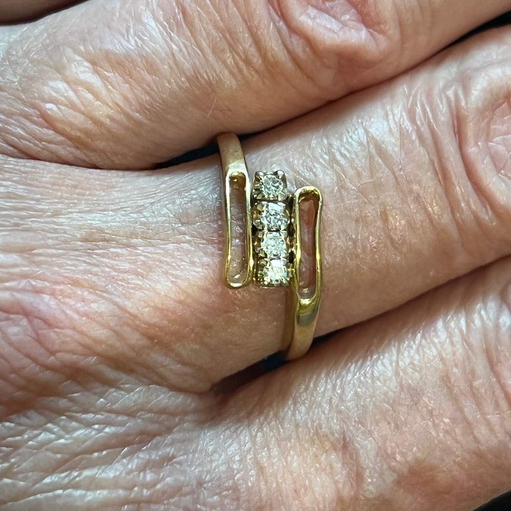 Genuine 4 diamond and yellow and gold ring, size 6. 10k gold.